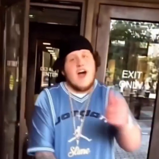 fat $lime walking out of the courthouse in a light blue jersey and his Slime chain